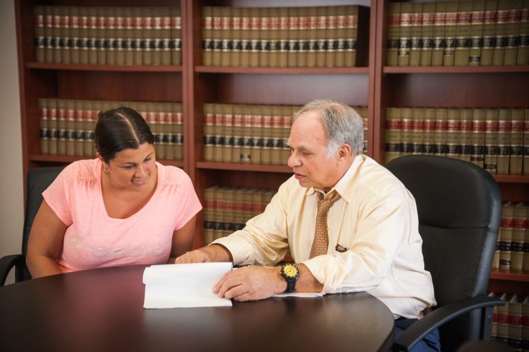 Timeshare attorney Michael D. Finn reviewing a timeshare contract with a client.