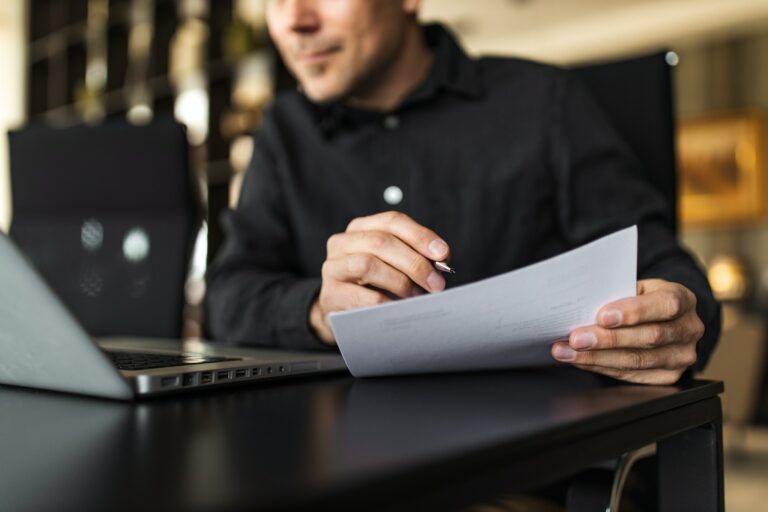 Man reading the 2022 CFA Consumer Complaint Survey