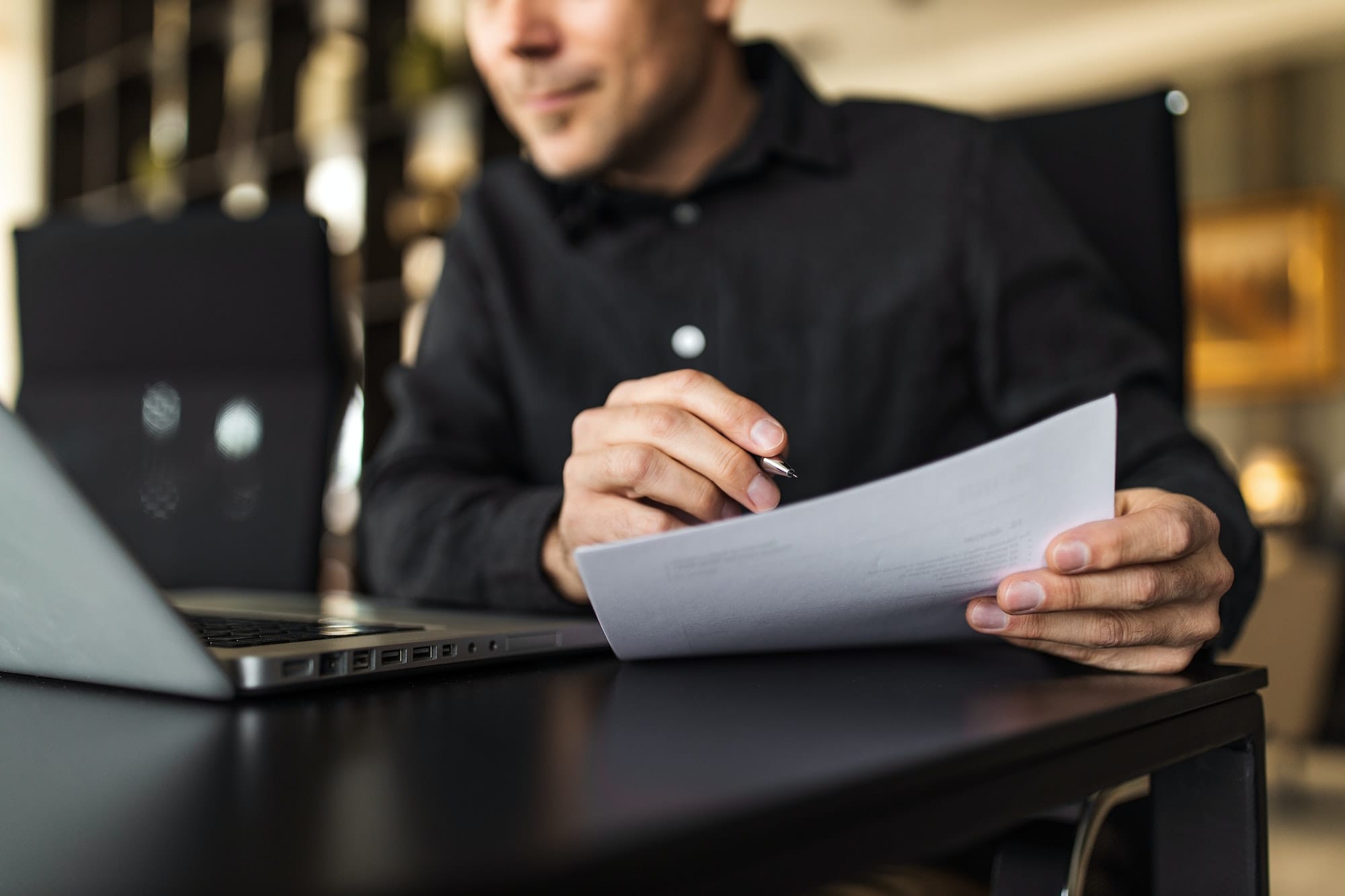 Man reading the 2022 CFA Consumer Complaint Survey