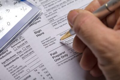 Income tax with instruction. Tax payment and filing concept